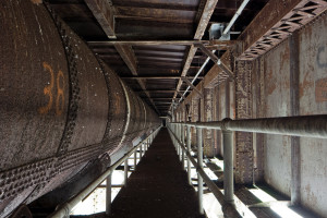 Catwalk under steel arch span and water pipe, 2009